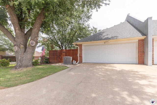 7 Brittan Pl, Texarkana, TX 75503 - view of home's exterior with brick siding, central air condition unit, concrete driveway, and a shingled roof