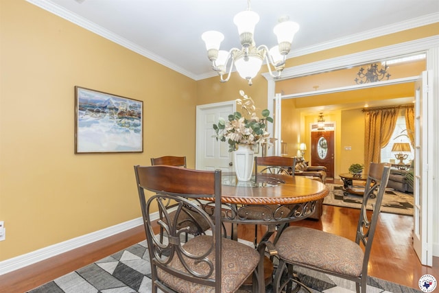 7 Brittan Pl, Texarkana, TX 75503 - dining space featuring a chandelier, wood finished floors, baseboards, and ornamental molding