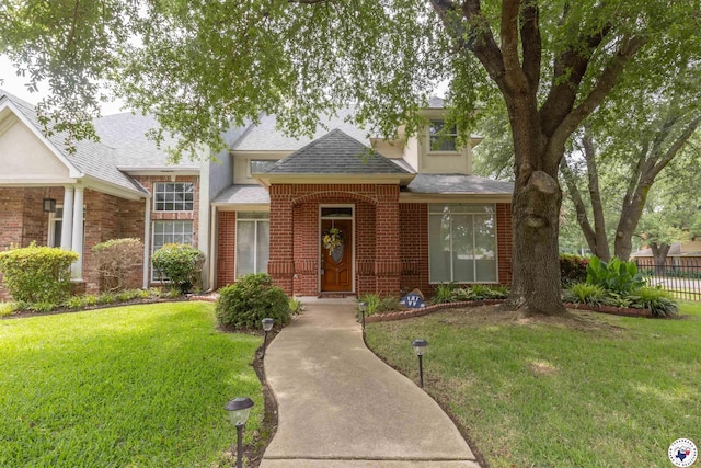 7 Brittan Pl, Texarkana, TX 75503 - traditional-style home with a shingled roof and brick siding
