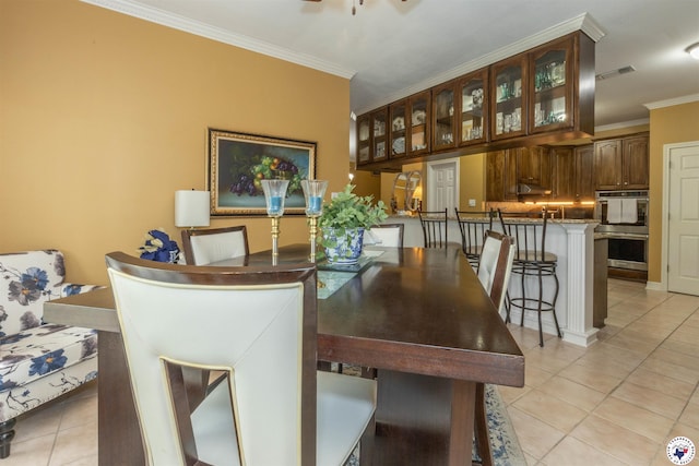 7 Brittan Pl, Texarkana, TX 75503 - dining room with light tile patterned flooring, crown molding, and a ceiling fan