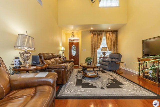 7 Brittan Pl, Texarkana, TX 75503 - living area featuring wood finished floors, a high ceiling, and baseboards