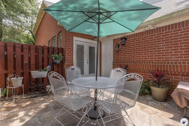 7 Brittan Pl, Texarkana, TX 75503 - view of patio / terrace featuring french doors and outdoor dining space