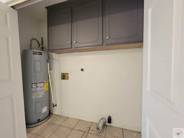 clothes washing area featuring water heater, cabinets, electric dryer hookup, hookup for a washing machine, and light tile patterned floors