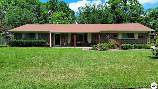 512 Langford Ln, New Boston, TX 75570 - ranch-style home featuring brick siding and a front lawn