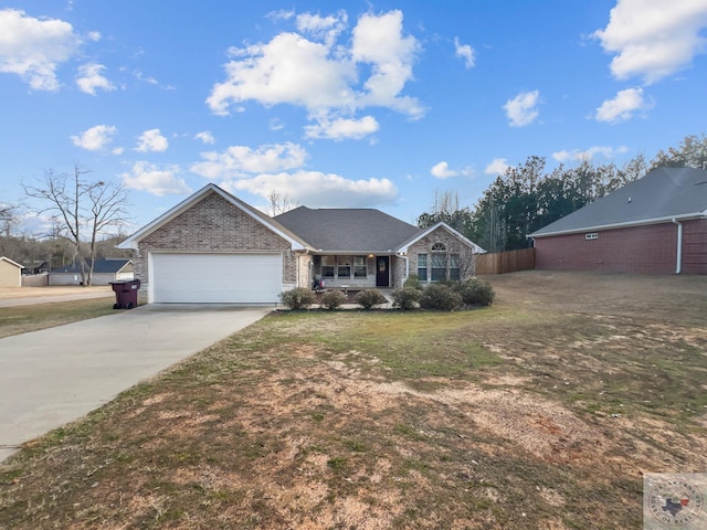 ranch-style home featuring an attached garage, brick siding, fence, concrete driveway, and a front yard