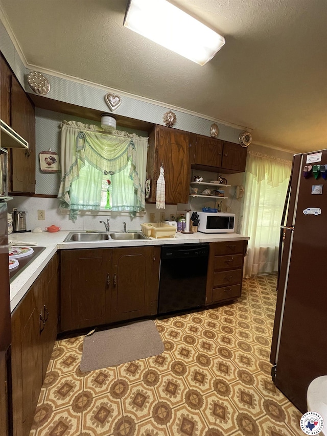530 Bentley Dr, Nash, TX 75569 - kitchen with dishwasher, freestanding refrigerator, white microwave, electric cooktop, and light countertops