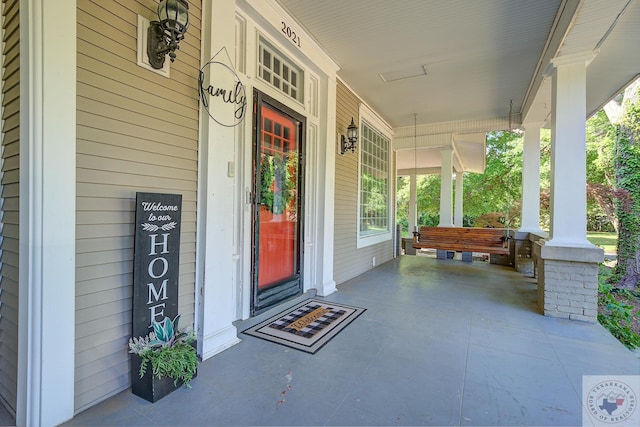 doorway to property with a porch