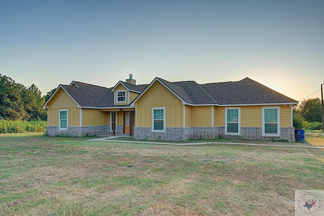 craftsman-style house with a yard