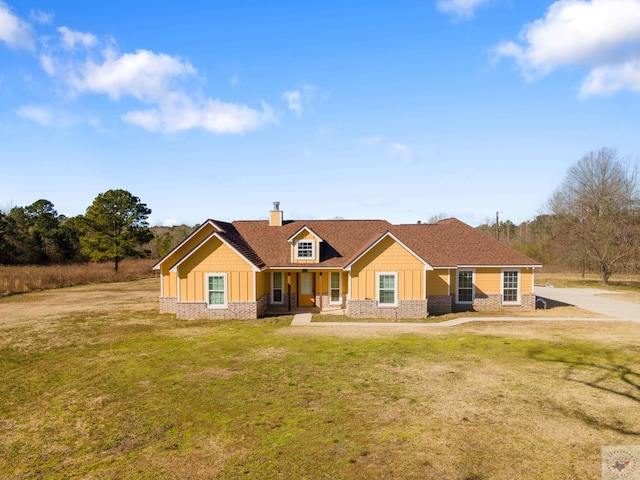 view of front of house featuring a front yard and covered porch