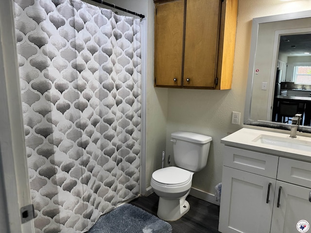 1205 W 40th St, Texarkana, TX 75503 - full bathroom featuring vanity, wood finished floors, and a shower