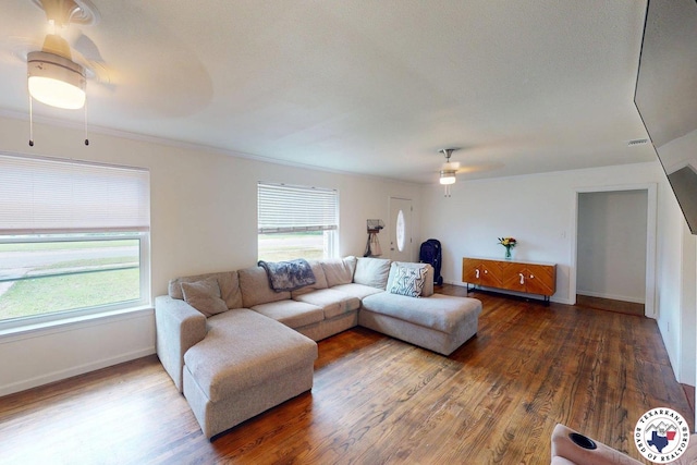 1205 W 40th St, Texarkana, TX 75501 - living area featuring ceiling fan, wood finished floors, and baseboards