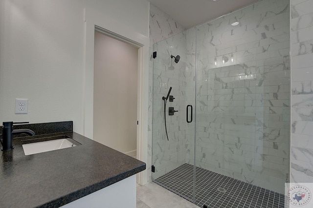 bathroom featuring vanity and an enclosed shower