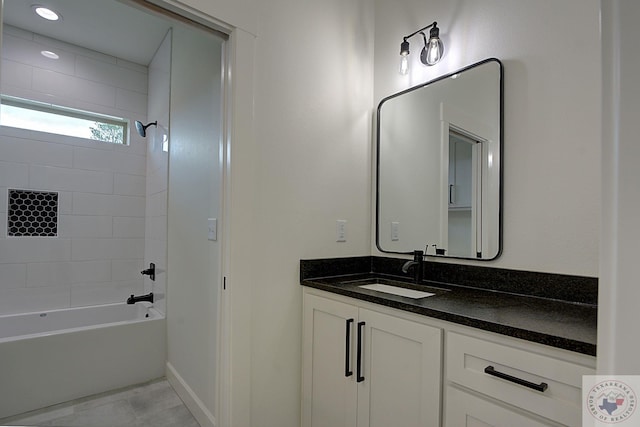 bathroom featuring tile patterned floors, vanity, and bathing tub / shower combination