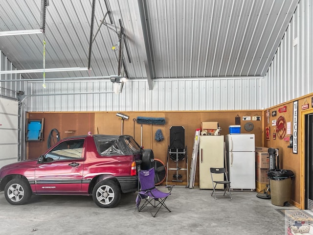 garage featuring white fridge