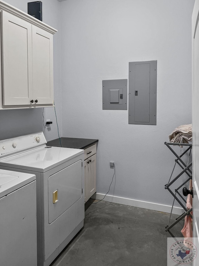 laundry area featuring cabinets, electric panel, and independent washer and dryer