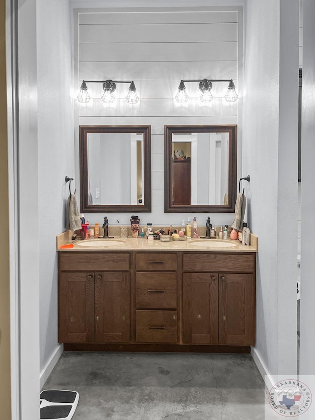 bathroom featuring concrete flooring and vanity