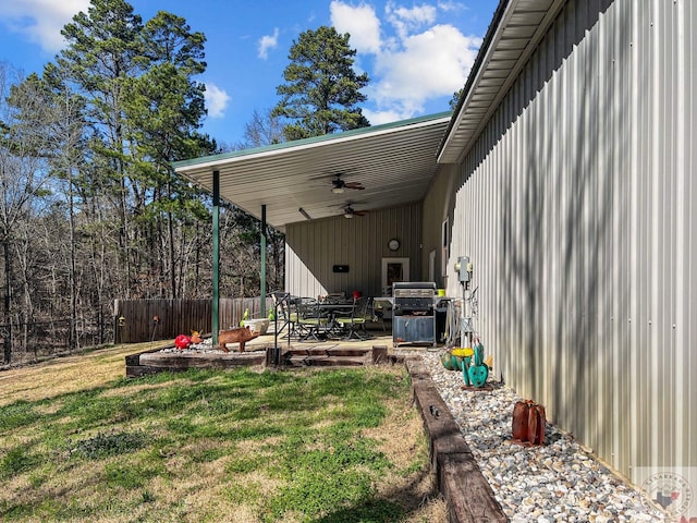 view of yard featuring a patio and ceiling fan