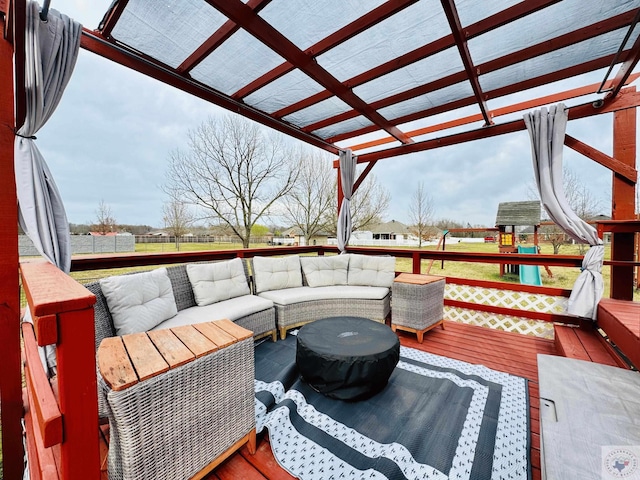 wooden deck with an outdoor living space and a pergola