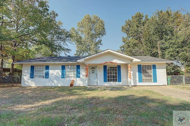 ranch-style house with covered porch and a front lawn