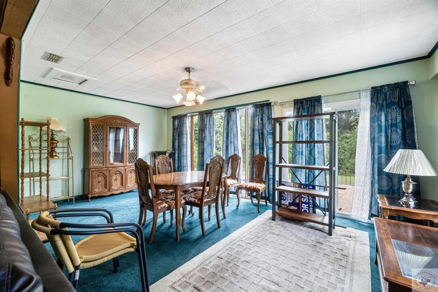 view of carpeted dining space