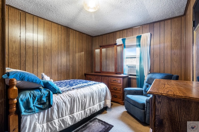 carpeted bedroom featuring wood walls, a textured ceiling, and cooling unit