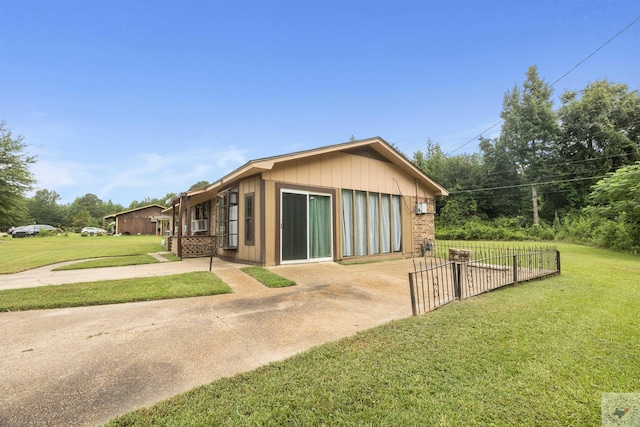 view of property exterior with a yard