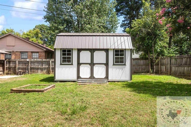 view of outdoor structure featuring a yard