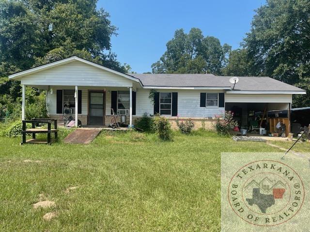 single story home featuring a front yard and a porch