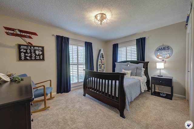 986 Texas Highway 77 W, Atlanta, TX 75551 - carpeted bedroom with baseboards, multiple windows, and a textured ceiling
