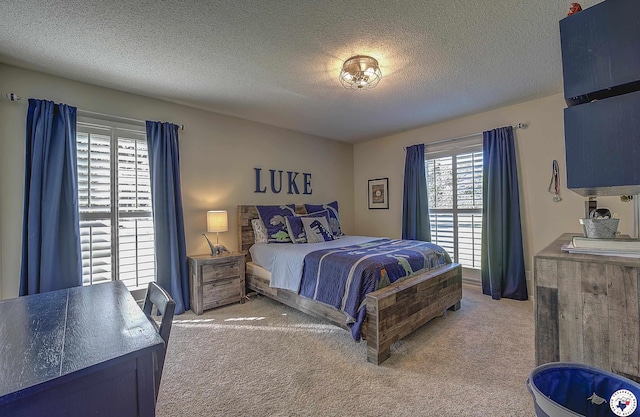 986 Texas Highway 77 W, Atlanta, TX 75551 - carpeted bedroom featuring a textured ceiling