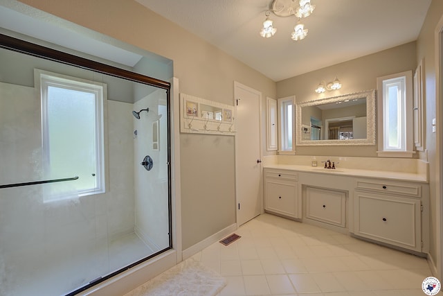 986 Texas Highway 77 W, Atlanta, TX 75551 - bathroom with a shower with shower door, vanity, visible vents, and a healthy amount of sunlight
