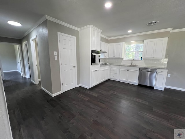 kitchen featuring dark hardwood / wood-style flooring, sink, white cabinets, tasteful backsplash, and stainless steel appliances