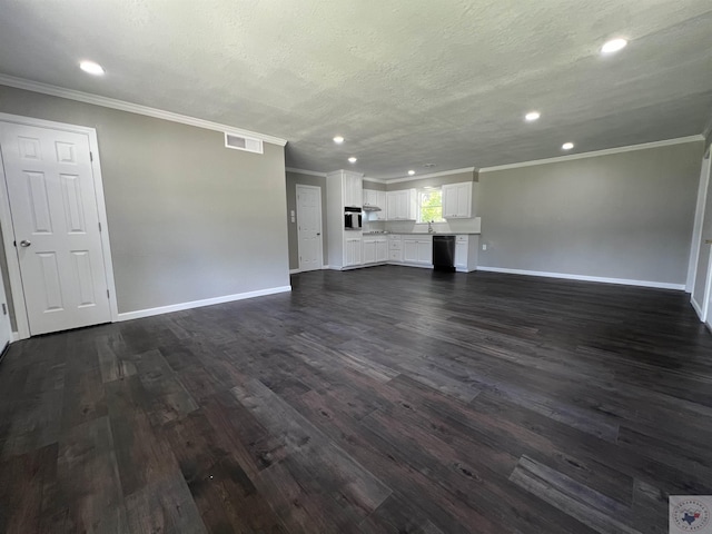 unfurnished living room featuring crown molding, dark wood-type flooring, and a textured ceiling