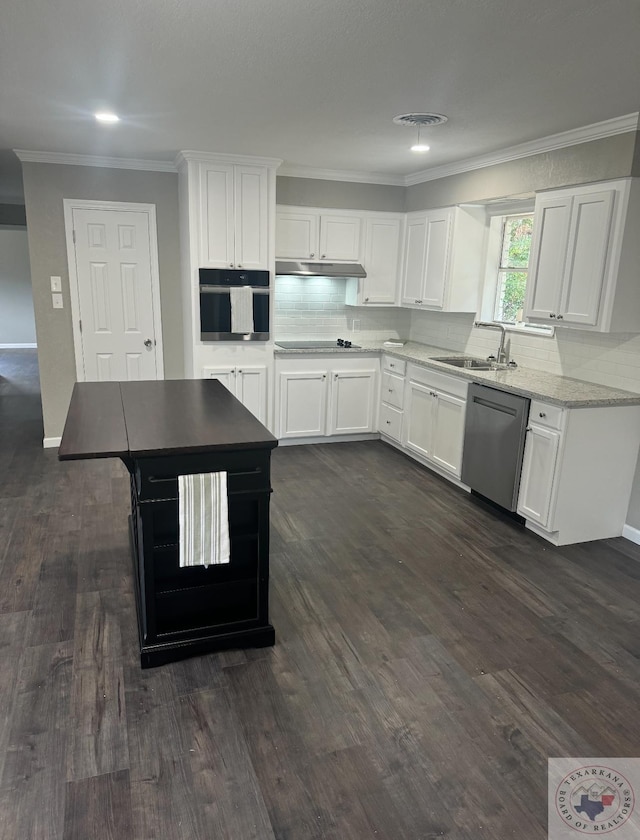 kitchen featuring dark hardwood / wood-style flooring, sink, white cabinets, a center island, and black appliances