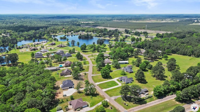 bird's eye view with a forest view and a water view