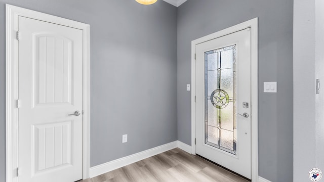 entrance foyer featuring light wood-style floors and baseboards