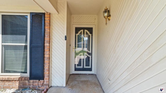 208 Jeffrey Ln, Wake Village, TX 75501 - doorway to property featuring brick siding