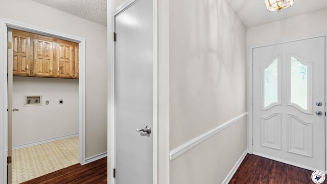 208 Jeffrey Ln, Wake Village, TX 75501 - foyer with dark wood-style floors, baseboards, and a textured ceiling
