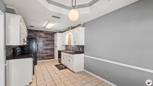 208 Jeffrey Ln, Wake Village, TX 75501 - kitchen featuring dark countertops, white cabinetry, backsplash, a sink, and dishwashing machine