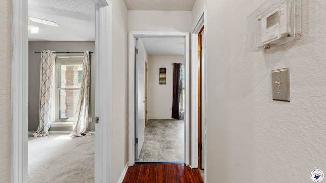 208 Jeffrey Ln, Wake Village, TX 75501 - hallway featuring a textured ceiling, baseboards, and a textured wall