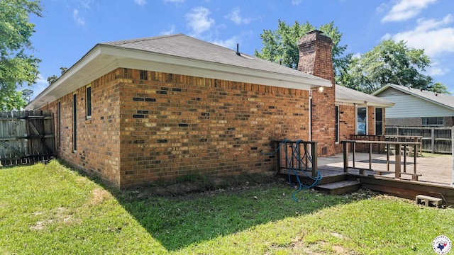 208 Jeffrey Ln, Wake Village, TX 75501 - view of property exterior with brick siding, a wooden deck, and a chimney