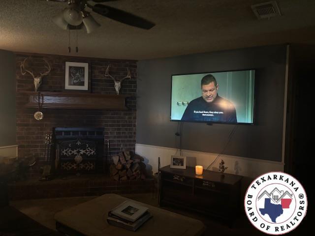 4903 Charleston St, Texarkana, AR 71854 - living area featuring a large fireplace and ceiling fan
