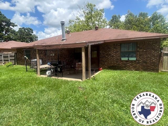 4903 Charleston St, Texarkana, AR 71854 - back of house with a patio and brick siding