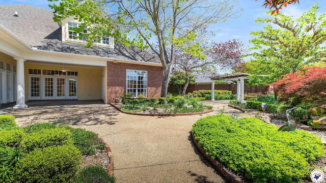 11 Dogwood Pl, Texarkana, TX 75503 - view of yard featuring french doors, a pergola, and a patio area