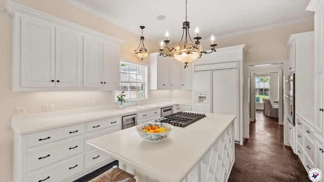 11 Dogwood Pl, Texarkana, TX 75503 - kitchen featuring a sink, paneled built in fridge, a wealth of natural light, and white cabinets