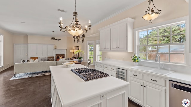 11 Dogwood Pl, Texarkana, TX 75503 - kitchen featuring visible vents, a sink, appliances with stainless steel finishes, ceiling fan with notable chandelier, and beverage cooler