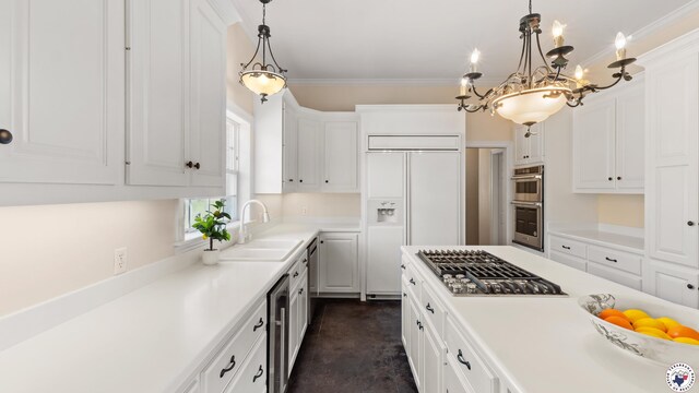 11 Dogwood Pl, Texarkana, TX 75503 - kitchen with an inviting chandelier, a sink, light countertops, appliances with stainless steel finishes, and white cabinetry