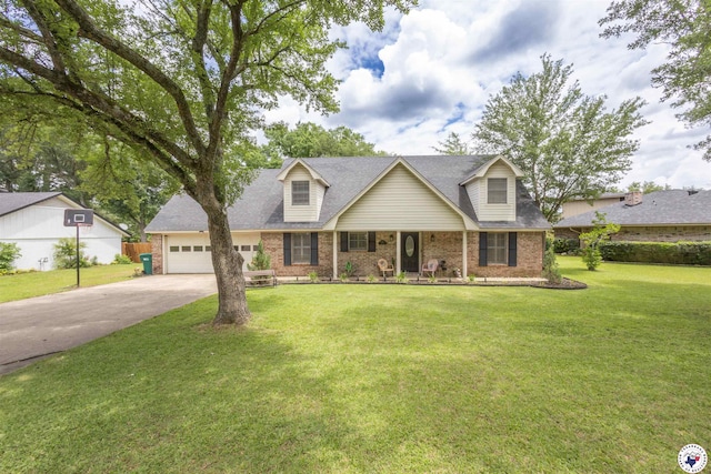 205 S Park Dr, New Boston, TX 75570 - cape cod home featuring brick siding, concrete driveway, a garage, a front lawn, and covered porch