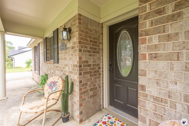205 S Park Dr, New Boston, TX 75570 - property entrance featuring brick siding and a porch