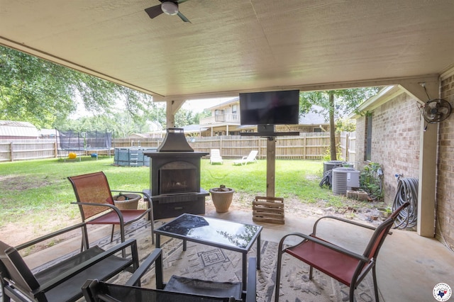 205 S Park Dr, New Boston, TX 75570 - view of patio featuring a trampoline, a ceiling fan, and central air condition unit